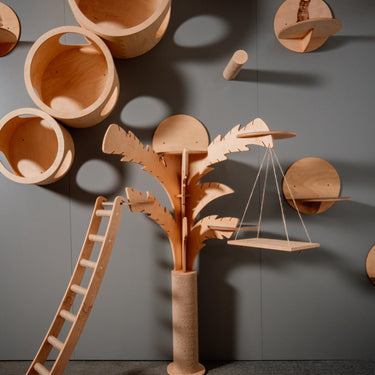 Modern wooden cat tree in the shape of a palm trees - a stylish complex for climbing and resting cats