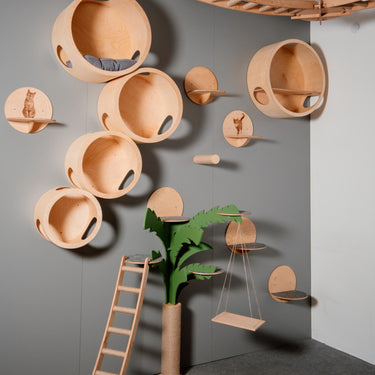 Modern wooden cat tree in the shape of a palm trees - a stylish complex for climbing and resting cats